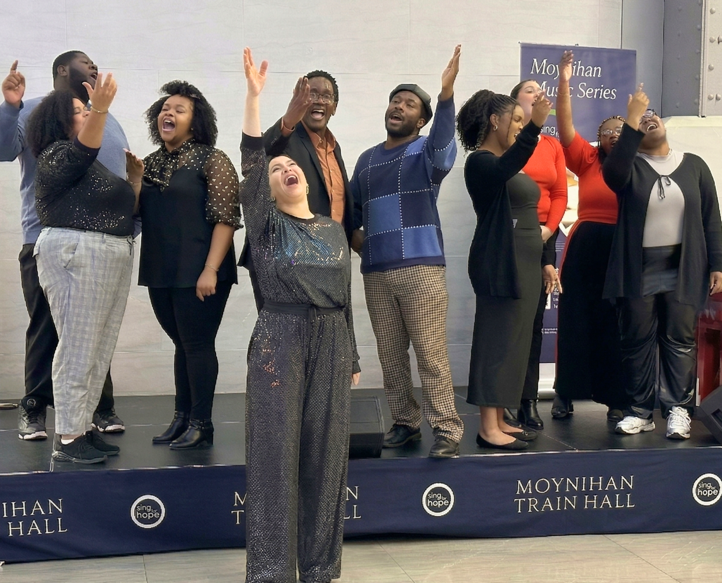 Ensemble lifting their voices at a Sing for Hope Piano site